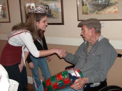 Ashley greeting a resident