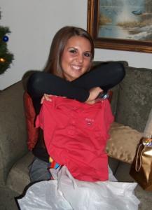 Katie opening her gift from Ashley
